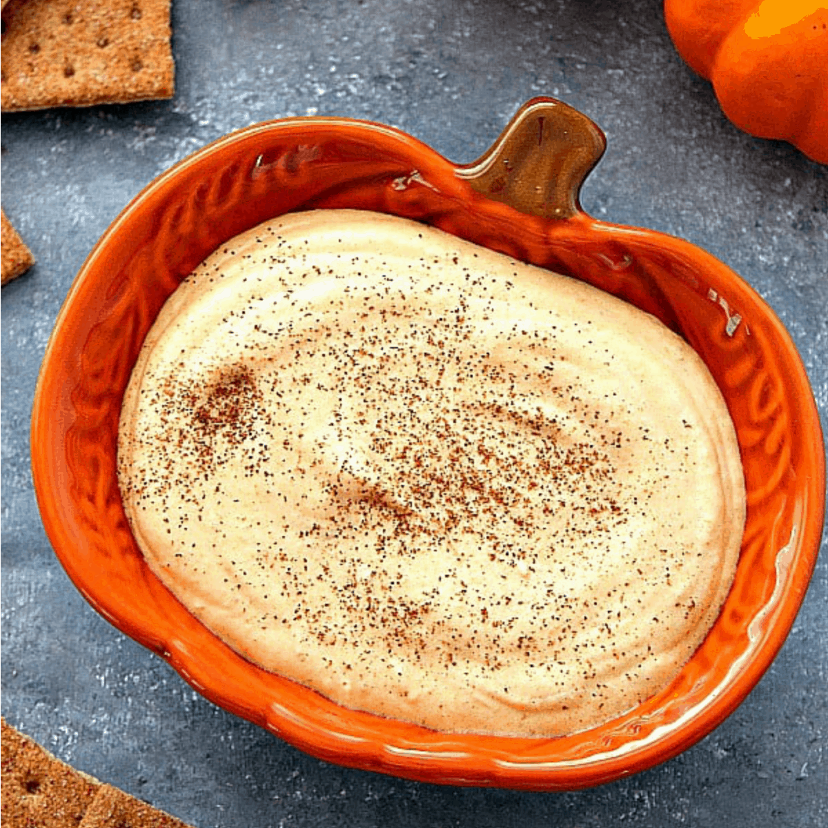 Pumpkin cheesecake dip in a dish.