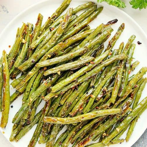 Roasted Green Beans on a white plate.