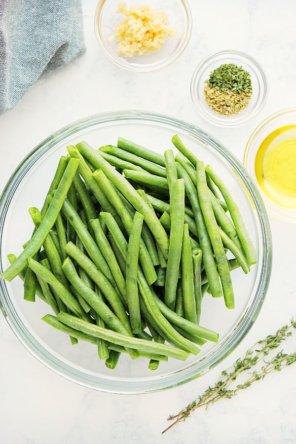Ingredients for Roasted Green Beans on a marble board.