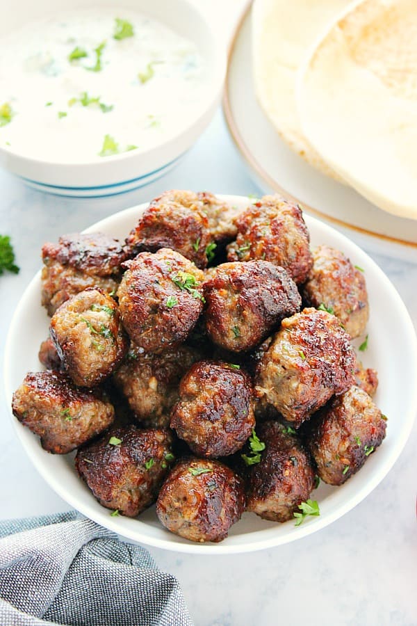 Ground lamb meatballs in a bowl.