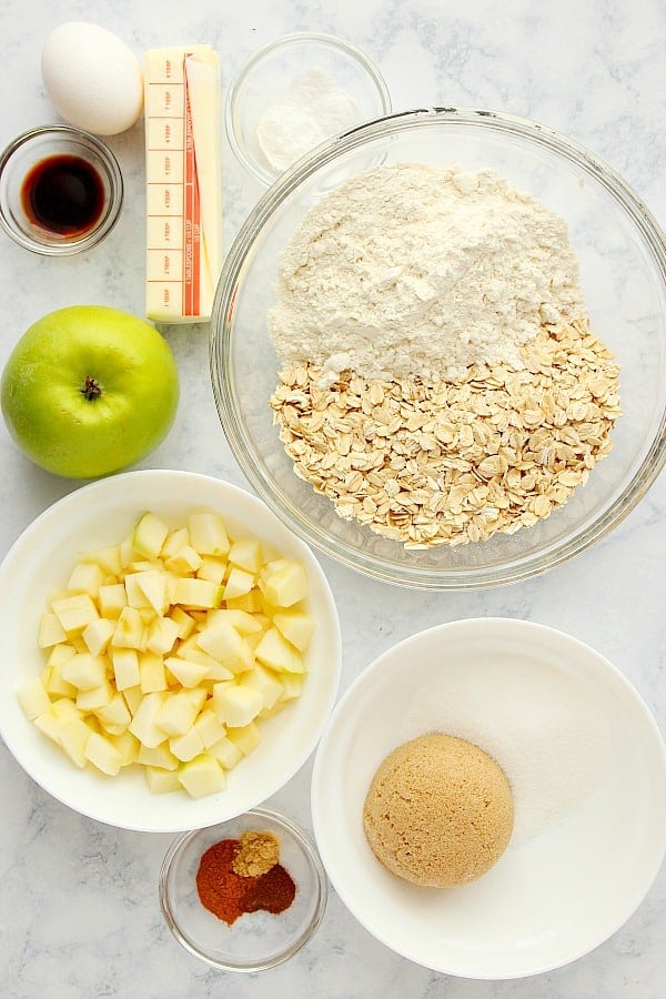 Apple Oatmeal Cookies ingredients on a marble board.