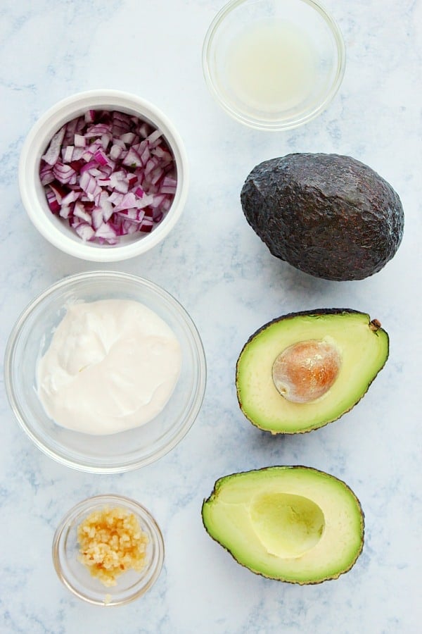 Avocado Dip ingredients on a marble board.