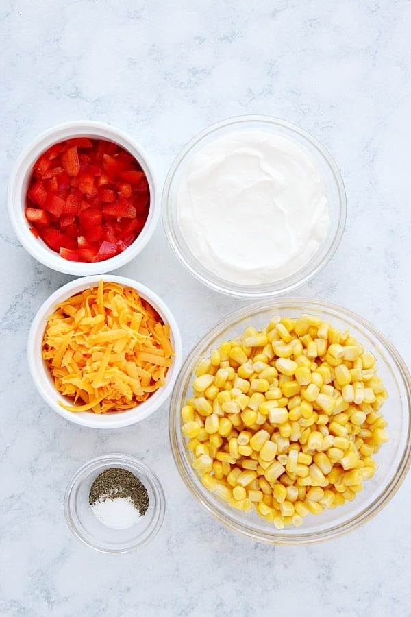 Corn Dip ingredients on a marble board.