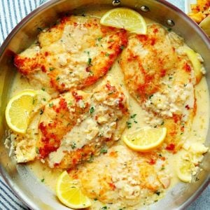 Lemon garlic chicken in a skillet.