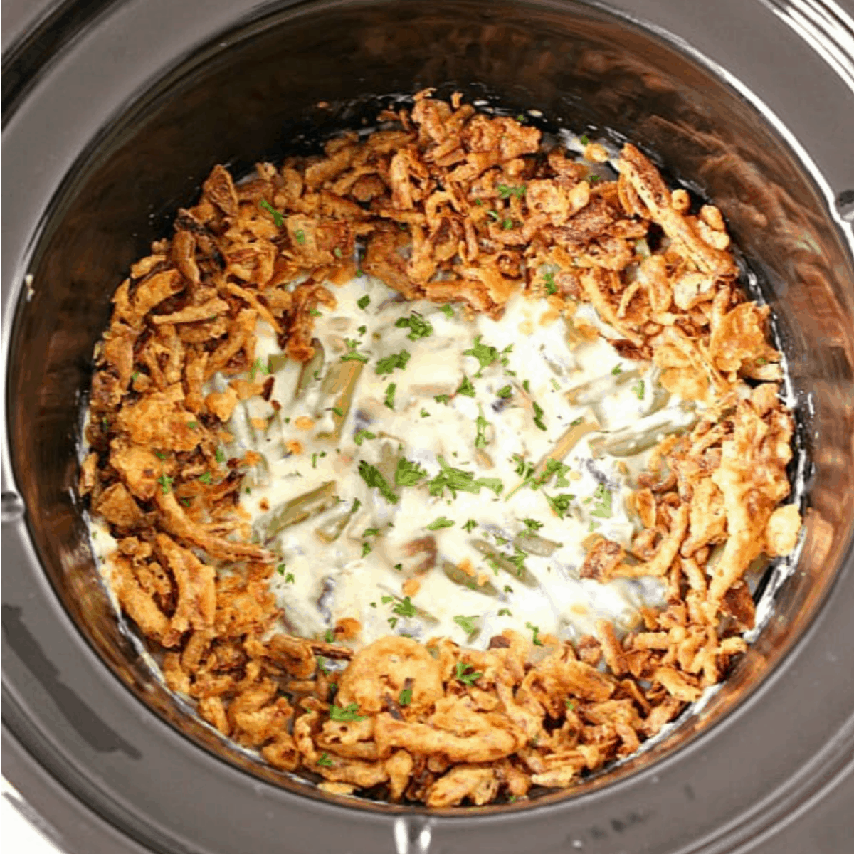 Green bean casserole in a slow cooker.