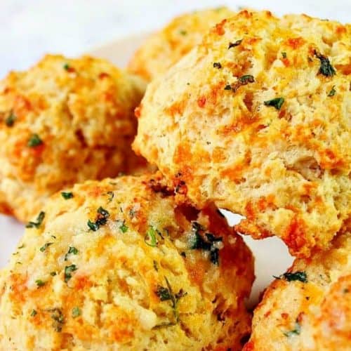Cheddar Bay biscuits on a plate.