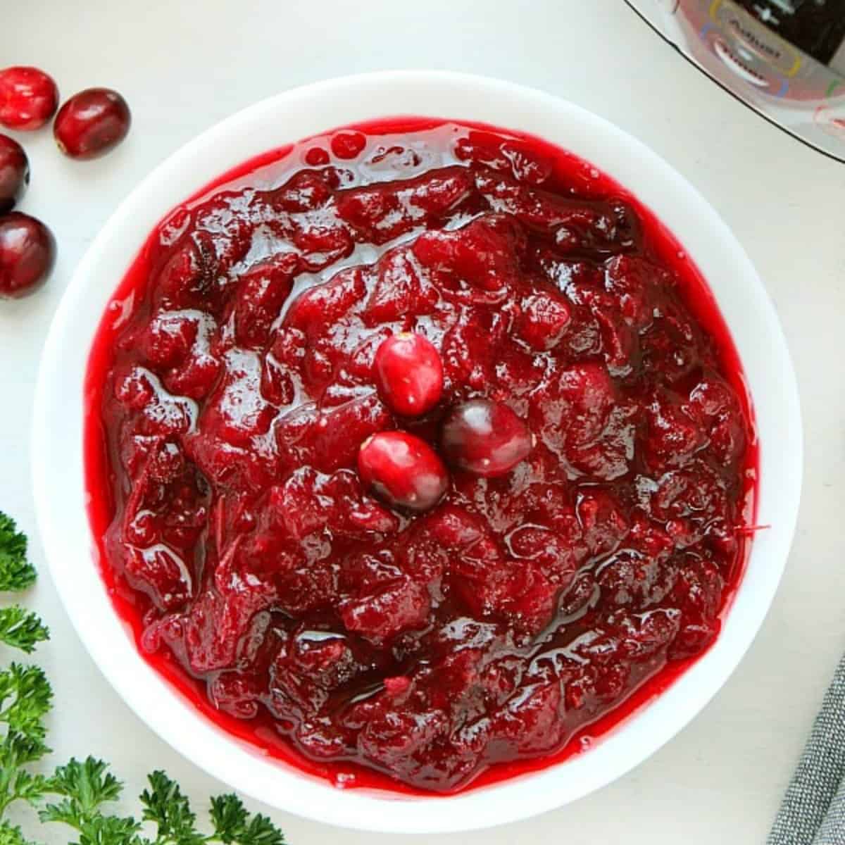 Cranberry sauce in a white bowl.