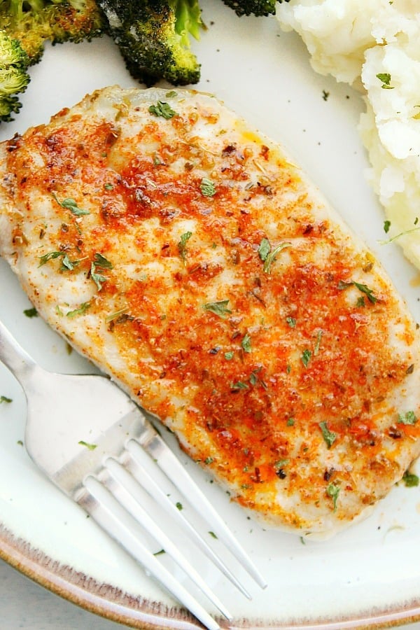 Baked Pork Chops on a white plate.