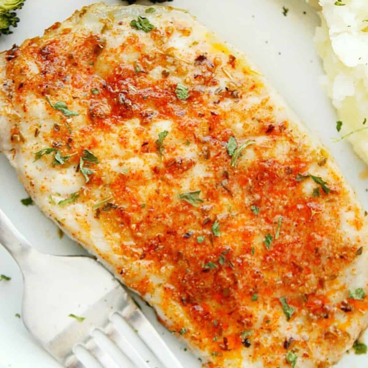 Baked pork chop on a baking sheet.