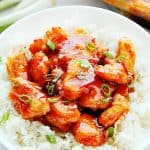 Firecracker Chicken on rice in white bowl.