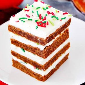 Gingerbread bars stacked on a plate.