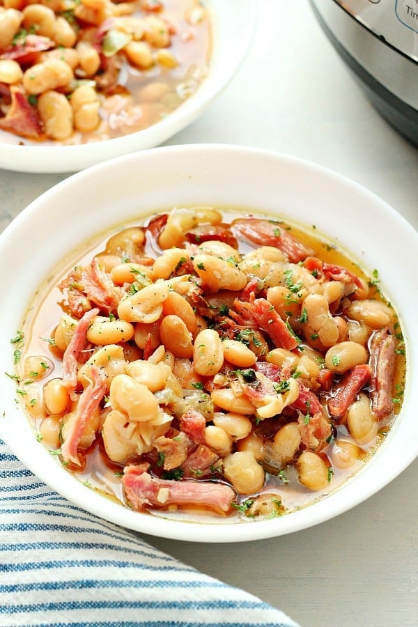 Instant Pot ham and bean soup in a white bowl.