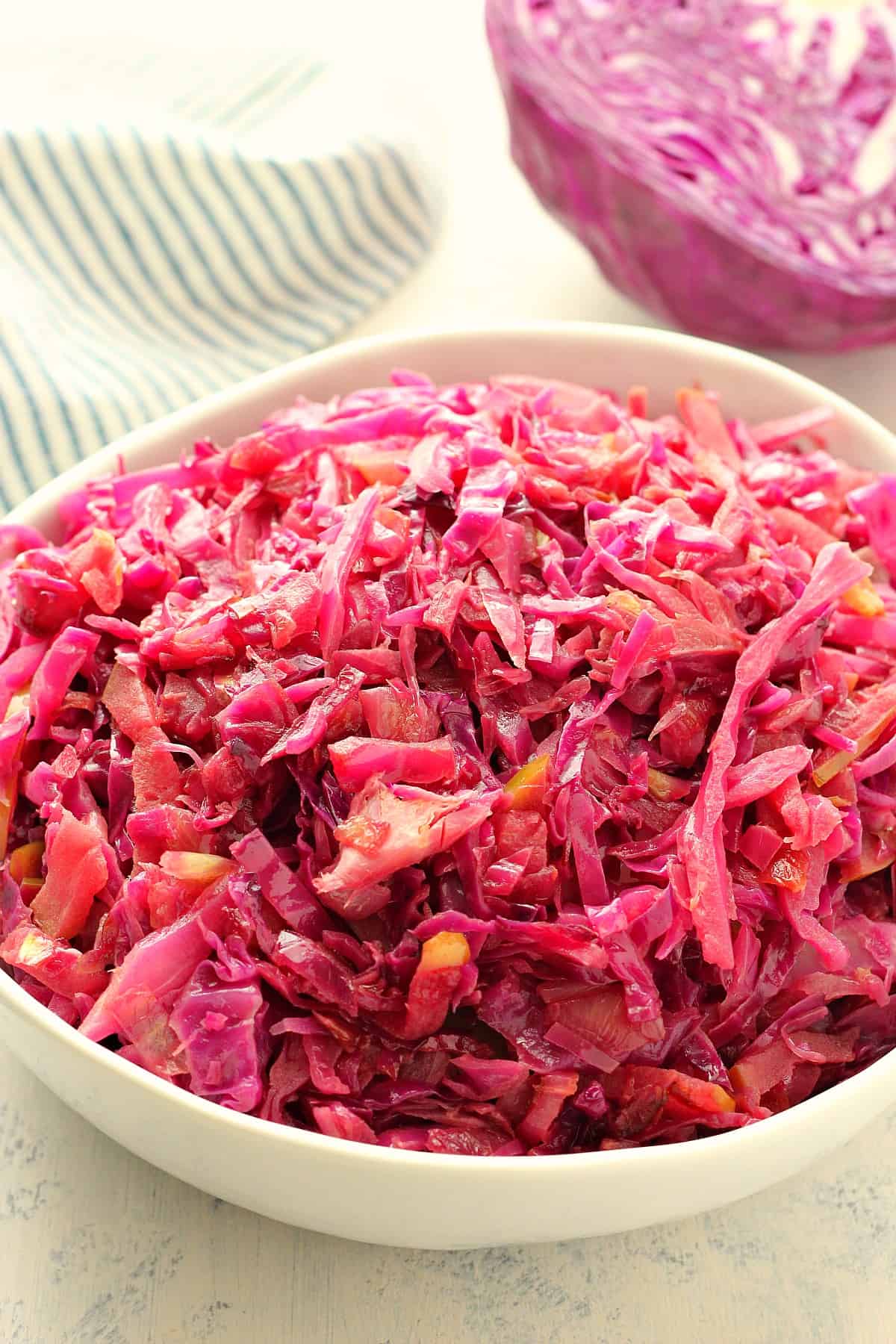 Red cabbage in a white bowl.