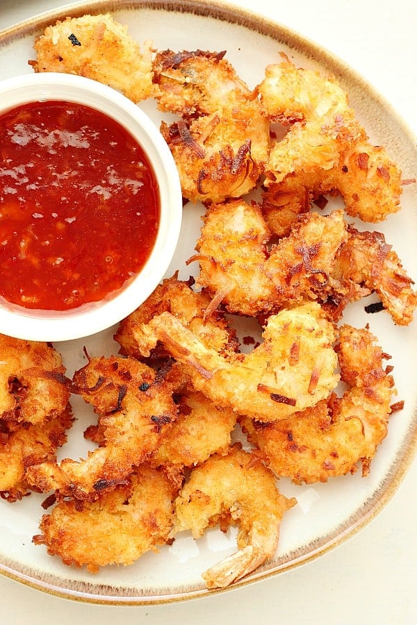 Coconut Shrimp are crispy on the outside and tender and juicy on the inside, fried or baked. Serve them with my Sweet Chili Orange Sauce. This appetizer is so much better than the restaurant kind!