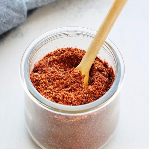 Taco seasoning in a glass jar.