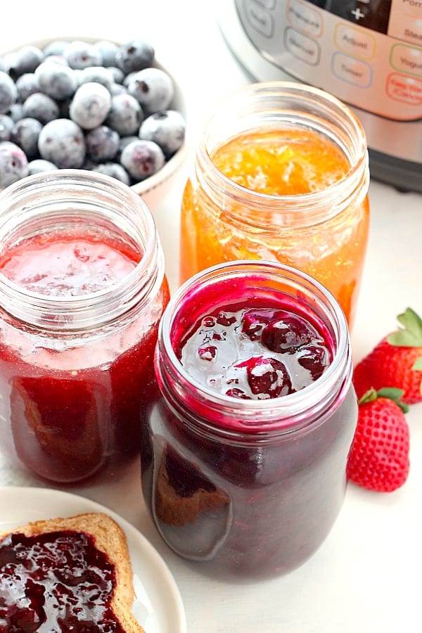 Jams in jars next to Instant Pot.