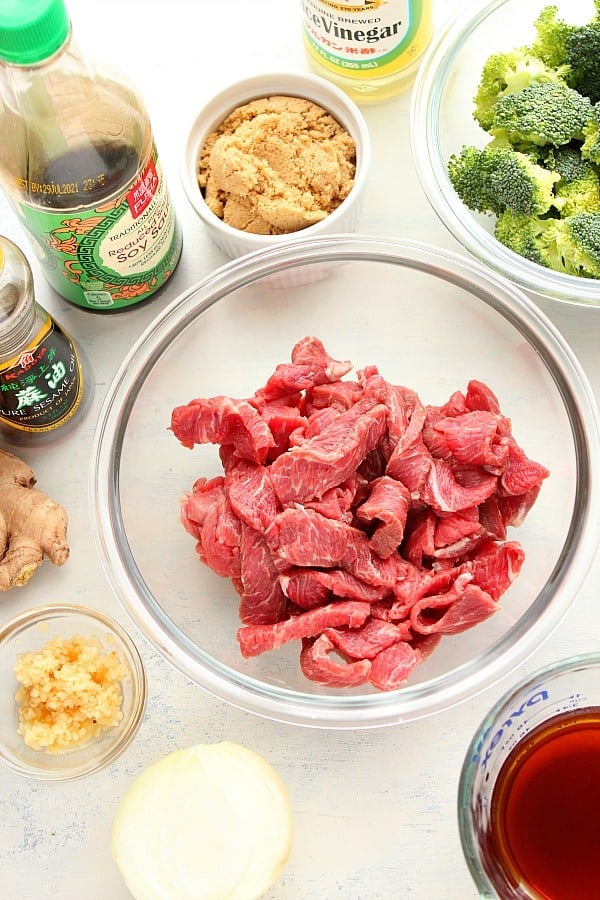 Ingredients for beef and broccoli recipe on a board.