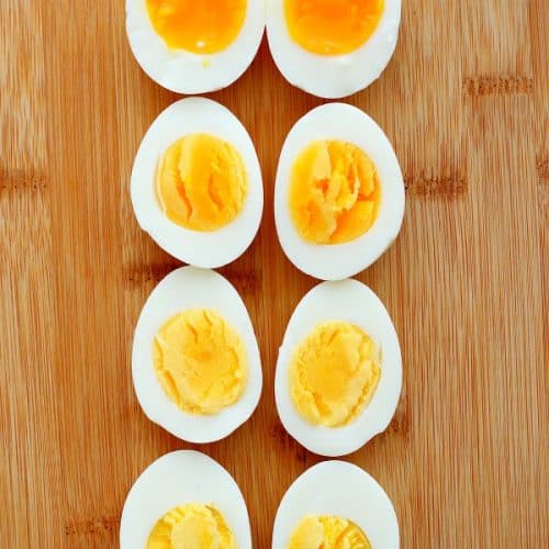 Boiled eggs on a cutting board.