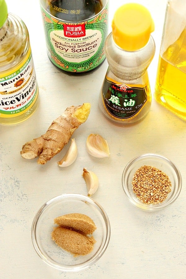 Ingredients for salad dressing on a board.