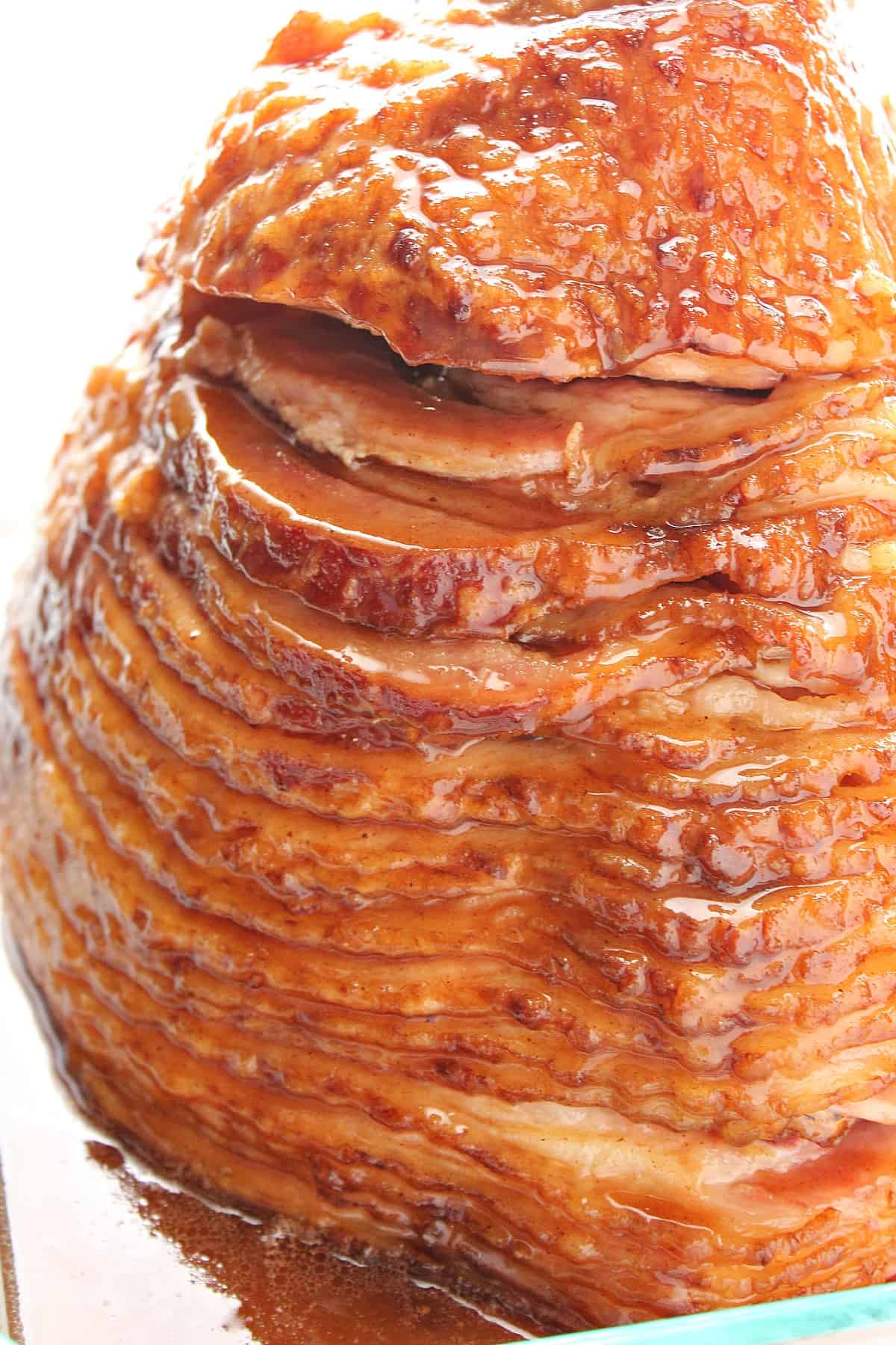Baked Ham with Honey Glaze Recipe Ham sliced in a baking dish.