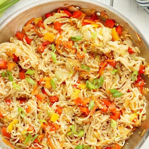 Stir fry with noodles in a skillet.