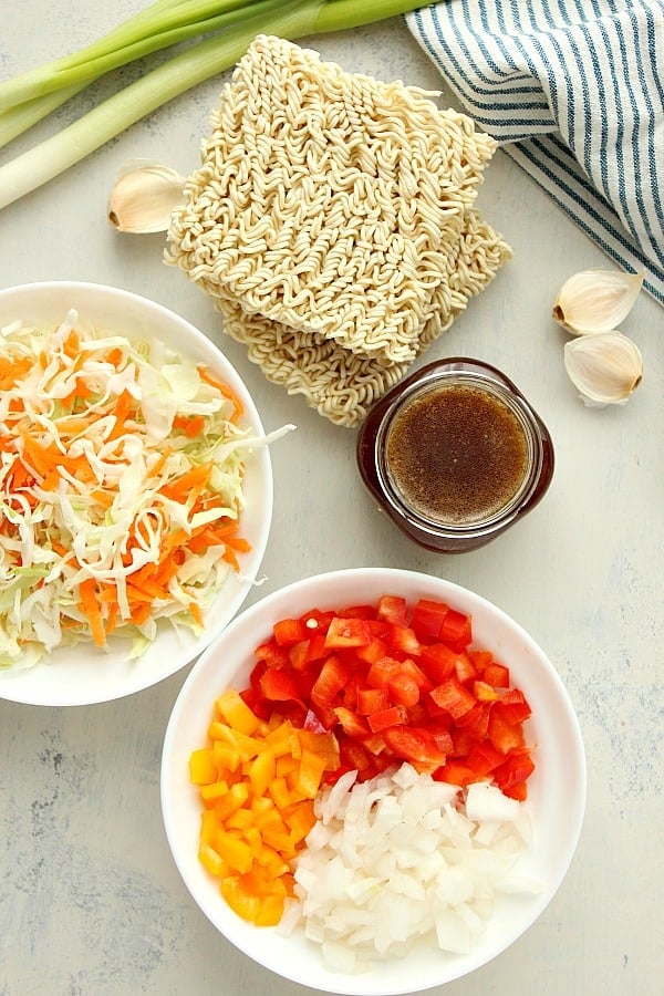 Ingredients for stir fry on a white board.