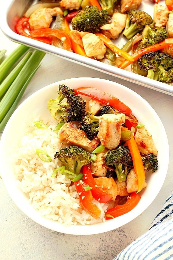 Sheet Pan Stir Fry with rice. Veggies and chicken with rice in a bowl.