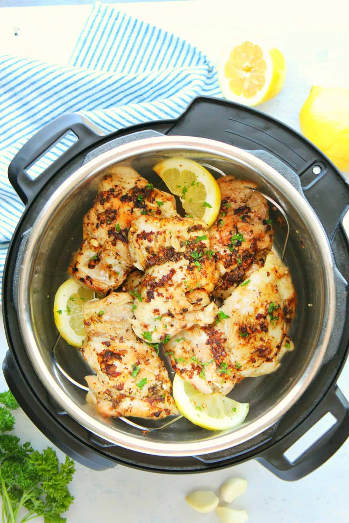 Chicken thighs in the Instant Pot with lemons.