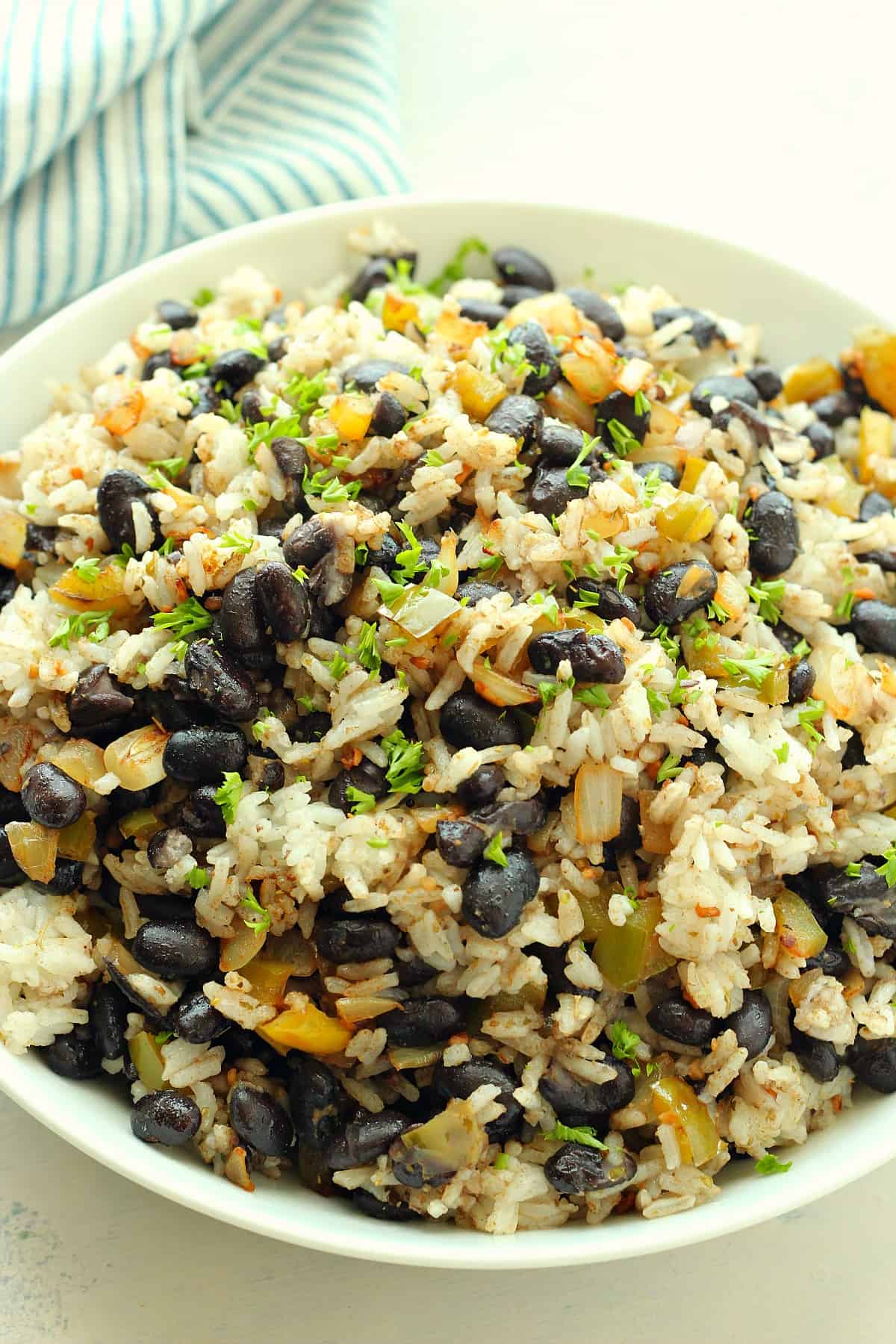 Beans with rice in a white bowl.