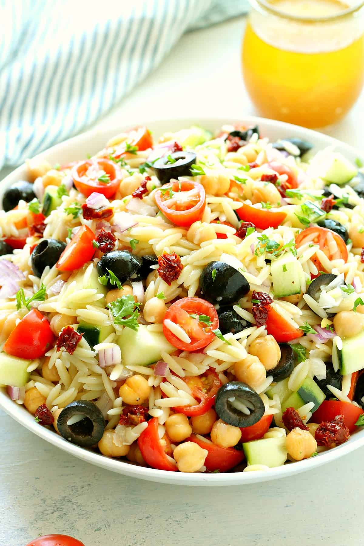 Orzo Pasta Salad recipe Pasta salad with veggies in a bowl.