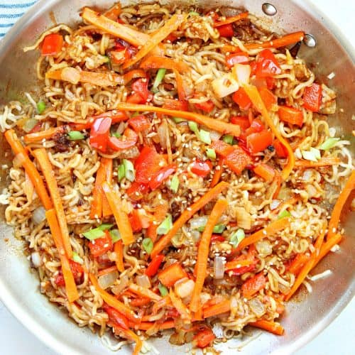 Noodles with veggies in a pan.