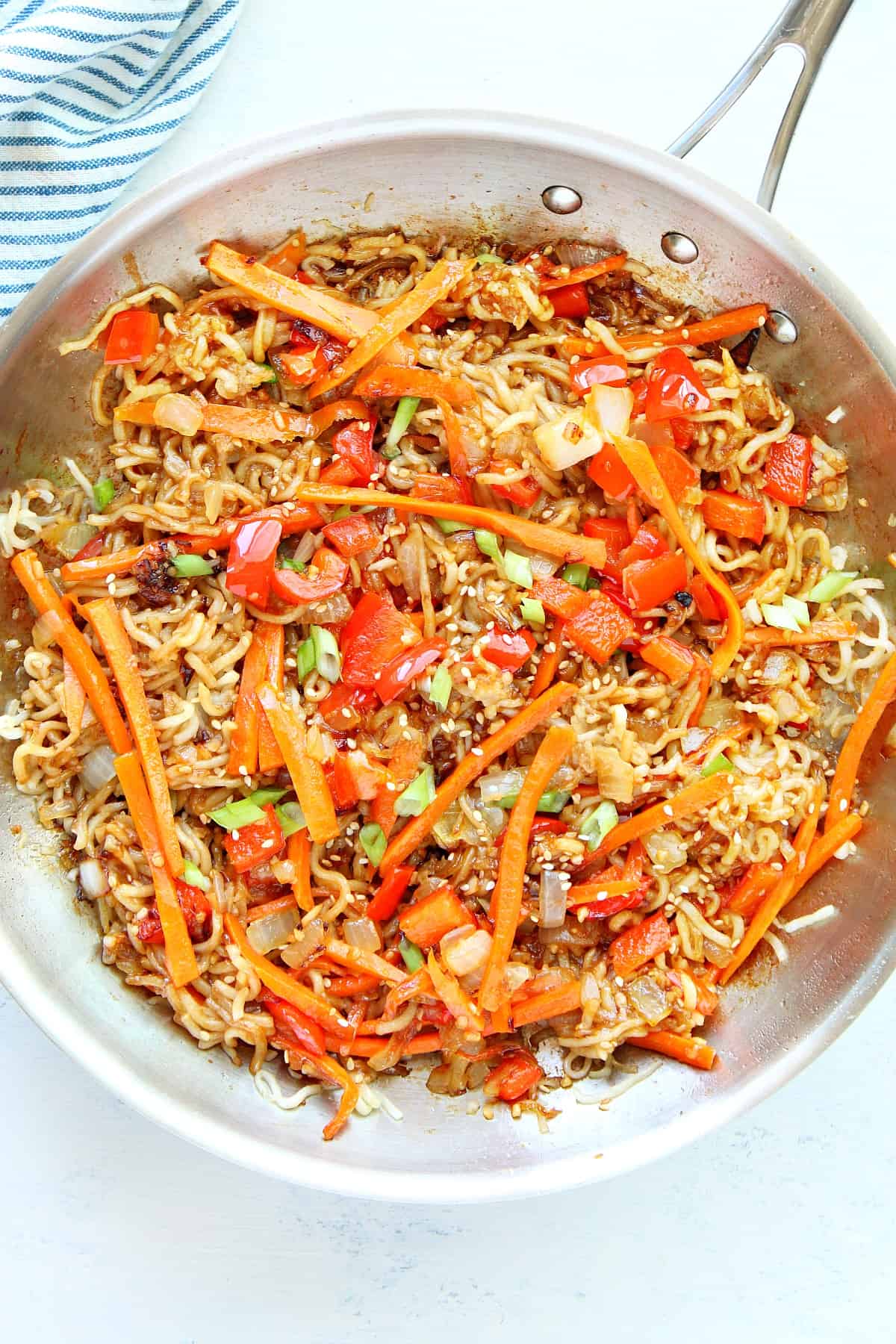 Noodles with veggies in a pan.