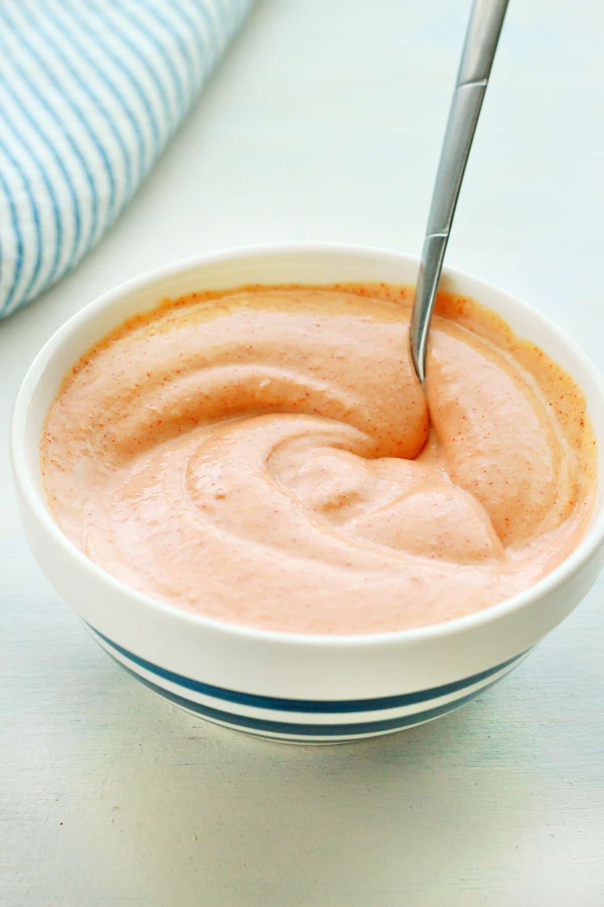 Hibachi sauce in a bowl with spoon.