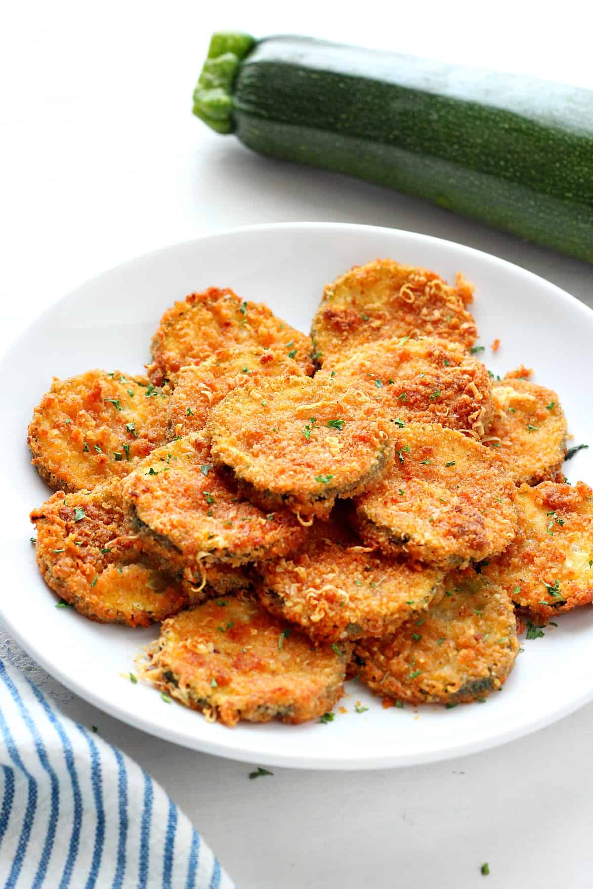 Air fried zucchini on a plate.