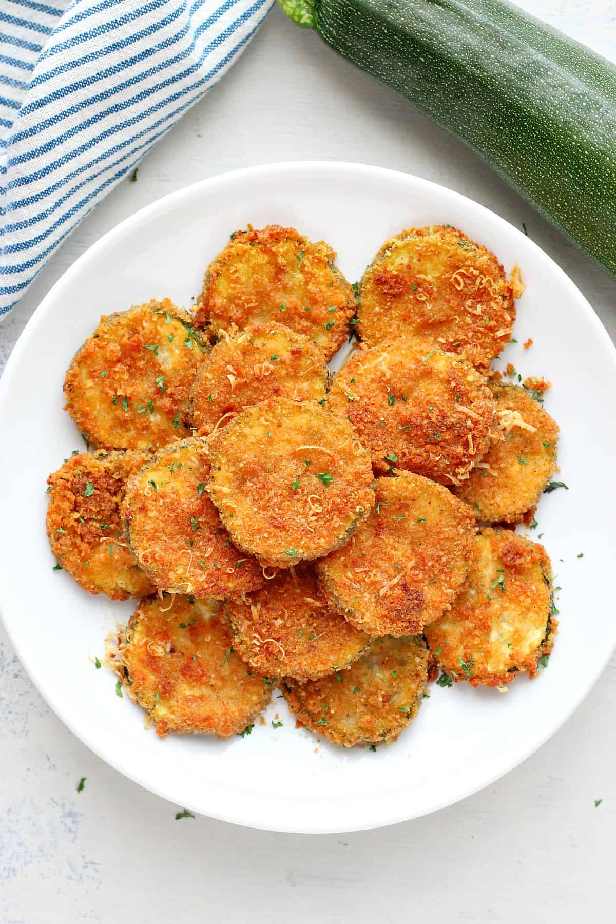 Air fried zucchini on a plate.
