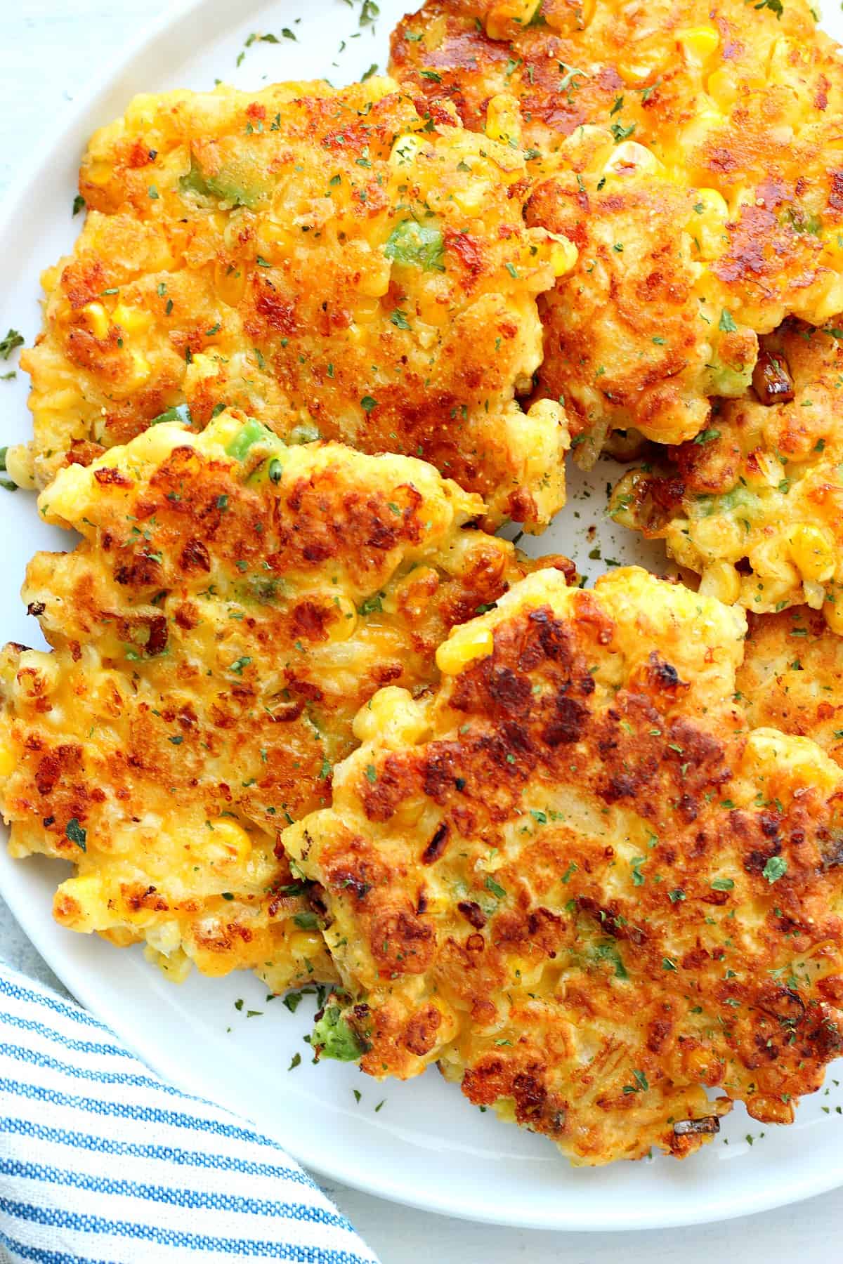 Corn Fritters Recipe Corn cakes on a plate.