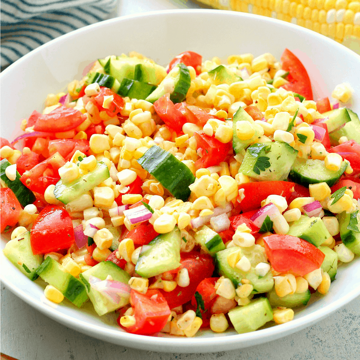 Corn salad with tomatoes and cucumber.