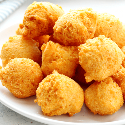 Hush puppies on a plate.