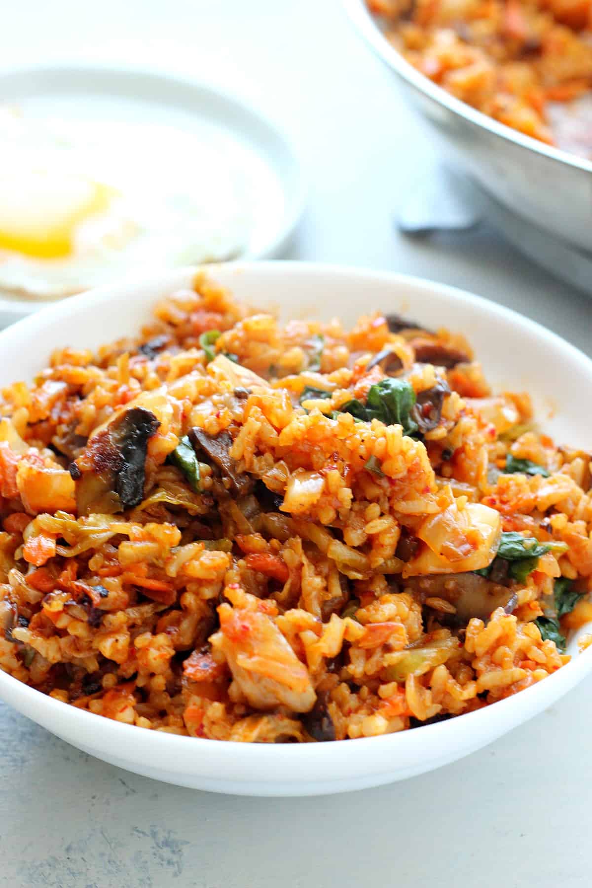 Cooked rice with kimchi in a bowl.