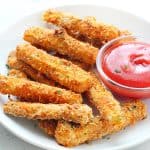 Zucchini fries on white plate.