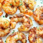 Cooked shrimp on white plate.