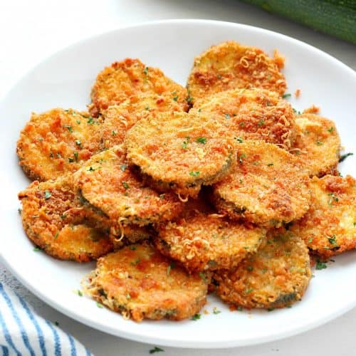 Fried zucchini on a white plate.