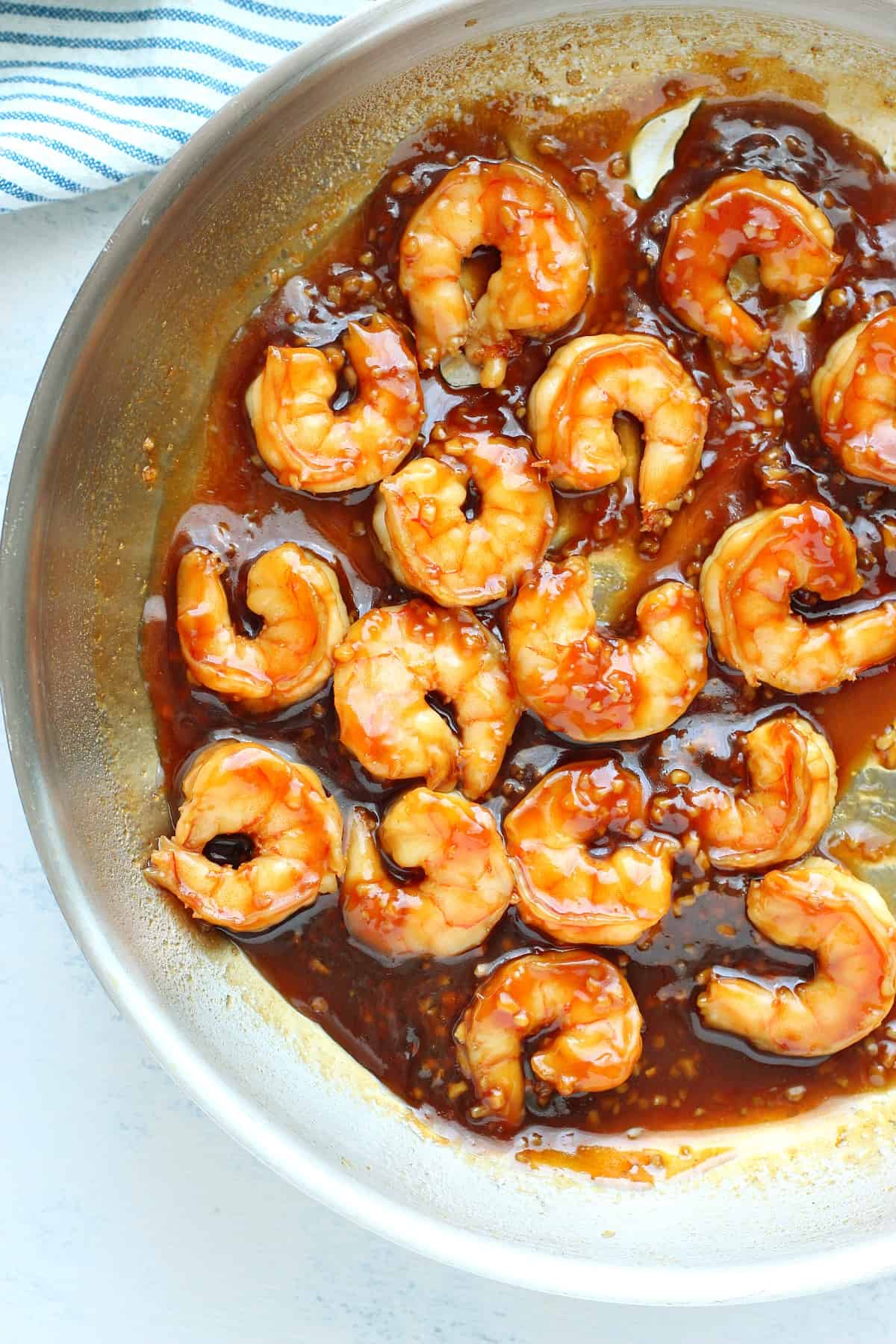 Shrimp with sauce in a pan.