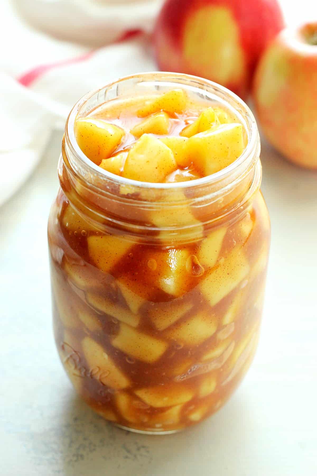 Apple pie filling in a glass jar.