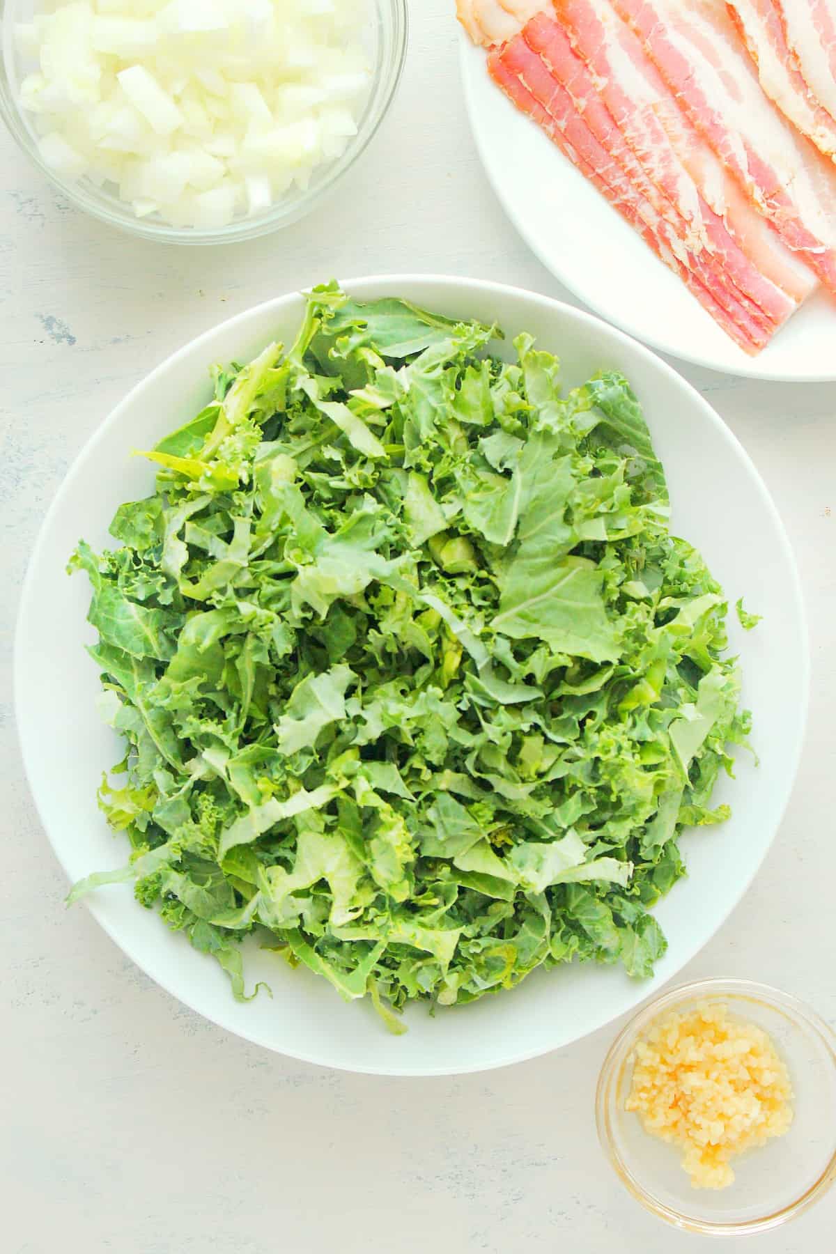 Ingredients for kale on a board.