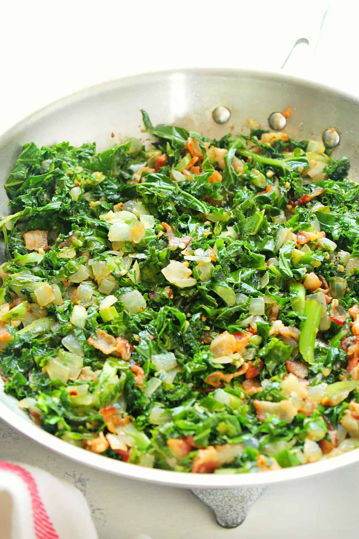 Sauteed kale in a skillet.
