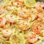 Shrimp with fettuccine in a pan.