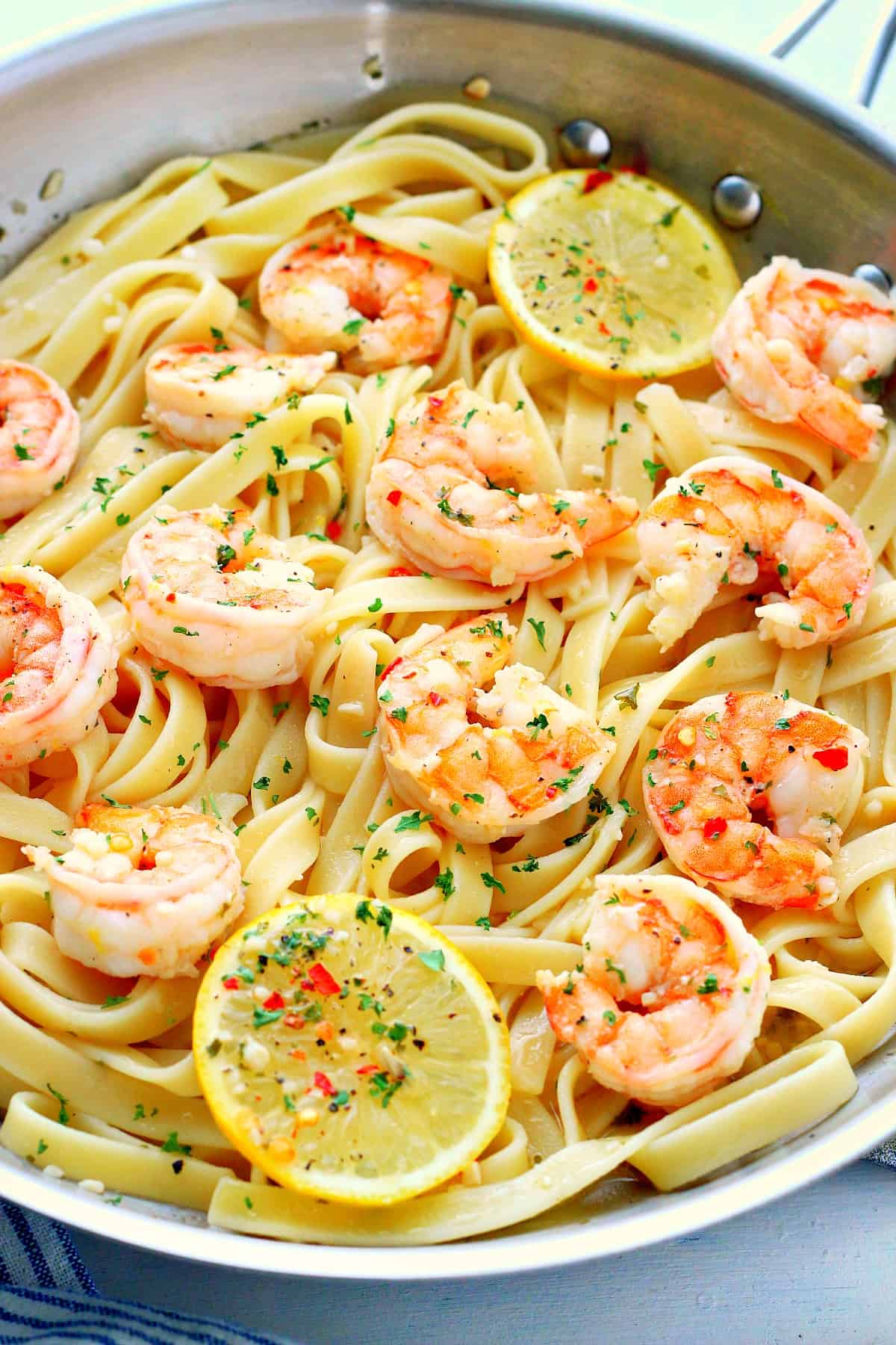 Shrimp with fettuccine in a pan.