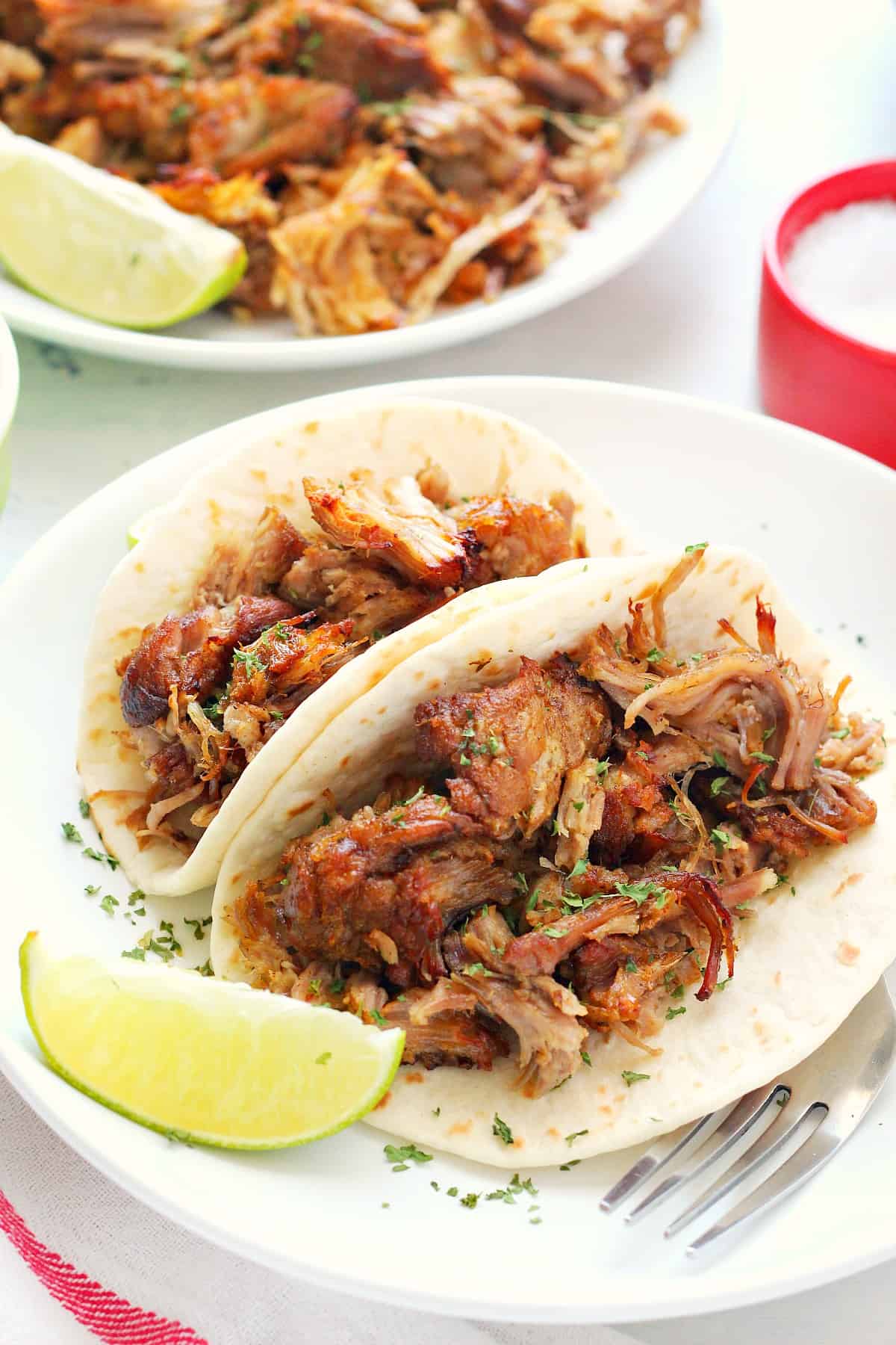 Pork carnitas in small tortillas.