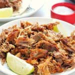 Carnitas meat on a white plate.